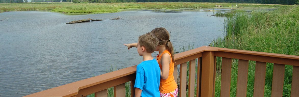 Two kids at pond